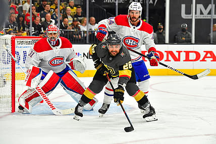 Jun 14, 2021; Las Vegas, Nevada, USA; Montreal Canadiens defenseman Joel Edmundson (44) checks Vegas Golden Knights left wing William Carrier (28) as Montreal Canadiens goaltender Carey Price (31) defends his goal during the first period of game one of the 2021 Stanley Cup Semifinals at T-Mobile Arena. Mandatory Credit: Stephen R. Sylvanie-USA TODAY Sports