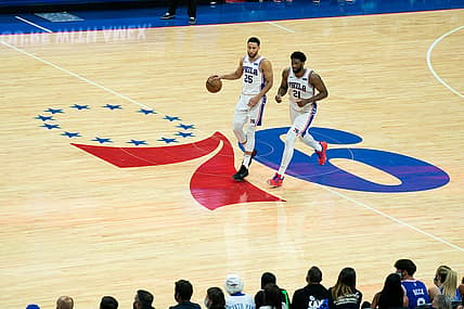 Jun 20, 2021; Philadelphia, Pennsylvania, USA; Philadelphia 76ers guard Ben Simmons (25) and center Joel Embiid (21) bring the ball up court against the Atlanta Hawks during the second quarter of game seven of the second round of the 2021 NBA Playoffs at Wells Fargo Center. Mandatory Credit: Bill Streicher-USA TODAY Sports