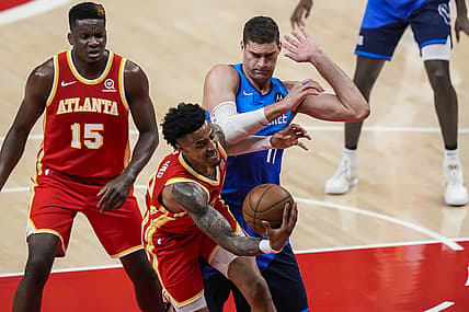 Jun 27, 2021; Atlanta, Georgia, USA; Atlanta Hawks forward John Collins (20) competes for rebound against Milwaukee Bucks center Brook Lopez (11) during the first quarter during game three of the Eastern Conference Finals for the 2021 NBA Playoffs at State Farm Arena. Mandatory Credit: Dale Zanine-USA TODAY Sports