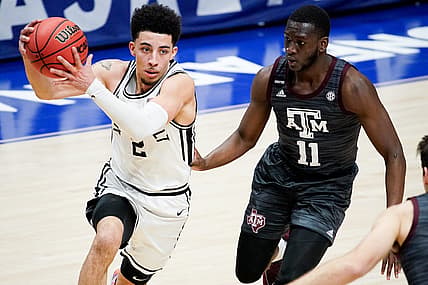 Vanderbilt guard Scotty Pippen Jr. (2) advances past Texas A&M guard Hassan Diarra (11) during the second half of the SEC Men's Basketball Tournament game at Bridgestone Arena in Nashville, Tenn., Wednesday, March 10, 2021.

Vandy Tam Sec 031021 An 024