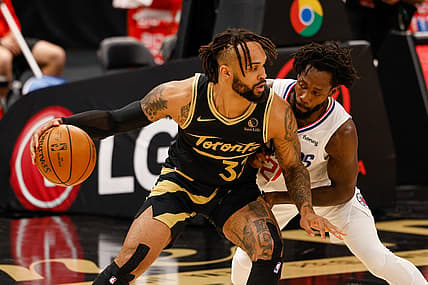 May 11, 2021; Tampa, Florida, USA;  Toronto Raptors guard Gary Trent Jr. (33) dribbles the ball against LA Clippers guard Patrick Beverley (21) in the first quarter at Amalie Arena. Mandatory Credit: Nathan Ray Seebeck-USA TODAY Sports