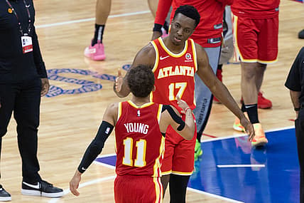 Jun 16, 2021; Philadelphia, Pennsylvania, USA; Atlanta Hawks guard Trae Young (11) shakes hands with forward Onyeka Okongwu (17) after a victory against the Philadelphia 76ers in game five of the second round of the 2021 NBA Playoffs at Wells Fargo Center. Mandatory Credit: Bill Streicher-USA TODAY Sports