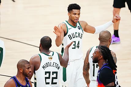 Jul 17, 2021; Phoenix, Arizona, USA; Milwaukee Bucks forward Giannis Antetokounmpo (34) celebrates with Milwaukee Bucks forward Khris Middleton (22) in the second half against the Phoenix Suns during game five of the 2021 NBA Finals at Phoenix Suns Arena. Mandatory Credit: Mark J. Rebilas-USA TODAY Sports
