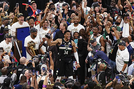 Jul 20, 2021; Milwaukee, Wisconsin, USA; Milwaukee Bucks forward Giannis Antetokounmpo (34) celebrates with the NBA Finals MVP Trophy following the game against the Phoenix Suns following game six of the 2021 NBA Finals at Fiserv Forum. Mandatory Credit: Jeff Hanisch-USA TODAY Sports