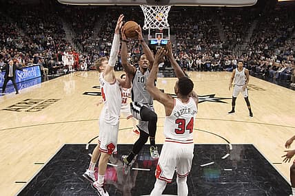 Dec 15, 2018; San Antonio, TX, USA; San Antonio Spurs shooting guard DeMar DeRozan (10) drives to the basket as Chicago Bulls power forward Lauri Markkanen (left) and Wendell Carter Jr. (34) defend during the second half at AT&T Center. Mandatory Credit: Soobum Im-USA TODAY Sports