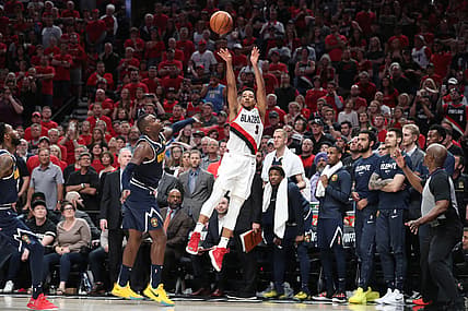 May 5, 2019; Portland, OR, USA; Portland Trail Blazers guard CJ McCollum (3) scores over Denver Nuggets forward Paul Millsap (4) in the second half of game four of the second round of the 2019 NBA Playoffs at Moda Center. Mandatory Credit: Jaime Valdez-USA TODAY Sports