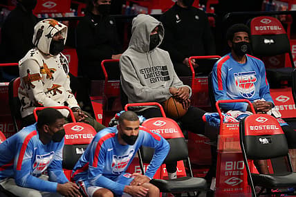 Apr 30, 2021; Brooklyn, New York, USA; Brooklyn Nets shooting guard James Harden (left to right) and power forward Kevin Durant (7) and point guard Kyrie Irving (11) sit on the bench during the third quarter against the Portland Trailblazers at Barclays Center. Harden and Durant didn't play in the game. Mandatory Credit: Brad Penner-USA TODAY Sports
