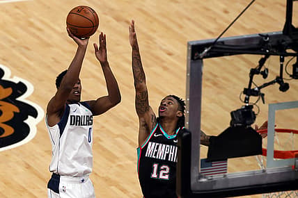 May 11, 2021; Memphis, Tennessee, USA; Dallas Mavericks guard Josh Richardson (0) shoot over Memphis Grizzlies guard Ja Morant (12) during the third quarter at FedExForum. Mandatory Credit: Petre Thomas-USA TODAY Sports