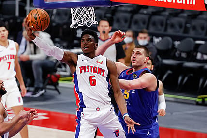 May 14, 2021; Detroit, Michigan, USA; Detroit Pistons guard Hamidou Diallo (6) goes to the basket on Denver Nuggets center Nikola Jokic (15) in the first half at Little Caesars Arena. Mandatory Credit: Rick Osentoski-USA TODAY Sports