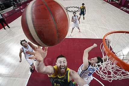 Jul 28, 2021; Saitama, Japan; Australia player Aron Baynes (12) shoots against Italy during the Tokyo 2020 Olympic Summer Games at Saitama Super Arena. Mandatory Credit: Kyle Terada-USA TODAY Sports