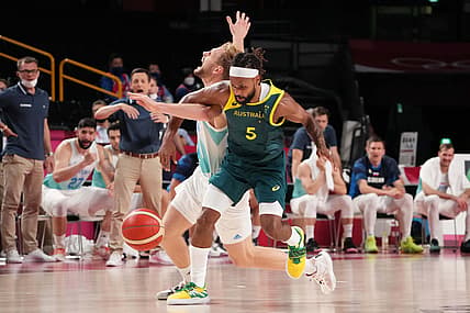Aug 7, 2021; Saitama, Team Australia point guard Patty Mills (5) knocks the ball away from Japan; Team Slovenia shooting guard Jaka Blazic (11) in the second half during the Tokyo 2020 Olympic Summer Games at Saitama Super Arena. Mandatory Credit: Kyle Terada-USA TODAY Sports