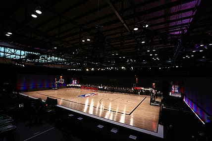 Jul 31, 2020; Lake Buena Vista, Florida, USA; Washington Wizards and Phoenix Suns players kneel behind a Black Lives Matters logo on the court before a NBA basketball game in the Visa Athletic Center at the ESPN Wide World of Sports Complex. Mandatory Credit: Kim Klement-USA TODAY Sports
