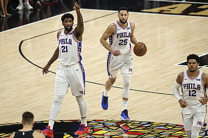 Jun 14, 2021; Atlanta, Georgia, USA; Philadelphia 76ers center Joel Embiid (21) calls a play as guard Ben Simmons (25) dribbles against the Atlanta Hawks in the first quarter during game four in the second round of the 2021 NBA Playoffs at State Farm Arena. Mandatory Credit: Brett Davis-USA TODAY Sports