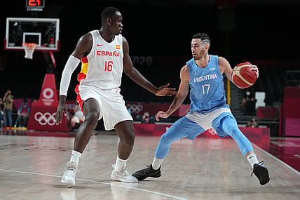 Jul 29, 2021; Saitama, Japan; Team Spain power forward Usman Garuba (16) guards Team Argentina point guard Luca Vildoza (17) during the Tokyo 2020 Olympic Summer Games at Saitama Super Arena. Mandatory Credit: Kareem Elgazzar-USA TODAY Sports