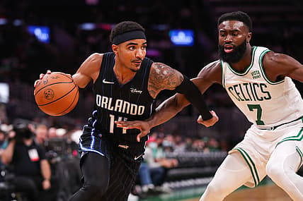 Oct 4, 2021; Boston, Massachusetts, USA; Boston Celtics guard Jaylen Brown (7) defends Orlando Magic guard Gary Harris (14) during the first half at TD Garden. Mandatory Credit: Paul Rutherford-USA TODAY Sports