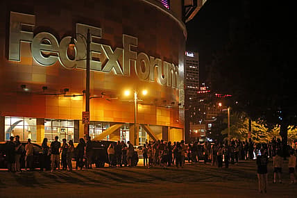 Oct 5, 2021; Memphis, Tennessee, USA; Fans wait outside of FedExForum after a fire stopped play during the third quarter of a game between the Memphis Grizzlies and the Milwaukee Bucks. Mandatory Credit: Petre Thomas-USA TODAY Sports