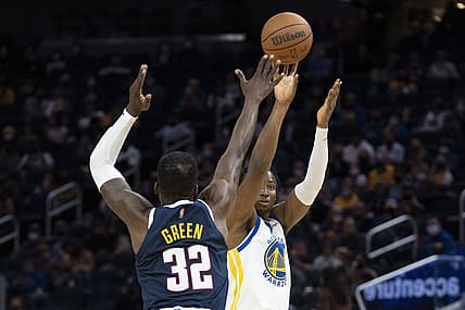 October 6, 2021; San Francisco, California, USA; Golden State Warriors forward Jonathan Kuminga (00) shoots the basketball against Denver Nuggets forward Jeff Green (32) during the third quarter at Chase Center. Mandatory Credit: Kyle Terada-USA TODAY Sports