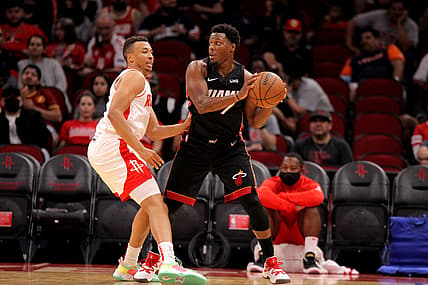 Oct 7, 2021; Houston, Texas, USA; Miami Heat guard Kyle Lowry (7) handles the ball while Houston Rockets guard Dante Exum (5) defends during the second quarter at Toyota Center. Mandatory Credit: Erik Williams-USA TODAY Sports