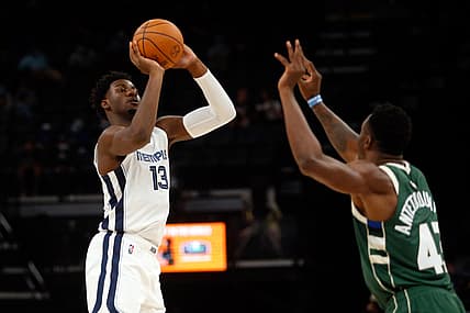 Oct 5, 2021; Memphis, Tennessee, USA; Memphis Grizzles forward Jaren Jackson Jr. (13) shoots for three during the first half against the Milwaukee Bucks at FedExForum. Mandatory Credit: Petre Thomas-USA TODAY Sports