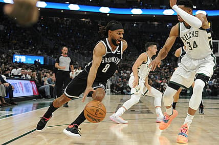 Oct 19, 2021; Milwaukee, Wisconsin, USA;  Brooklyn Nets guard Patty Mills (8) drives to the basket against Milwaukee Bucks forward Giannis Antetokounmpo (34) in the first half at Fiserv Forum. Mandatory Credit: Michael McLoone-USA TODAY Sports