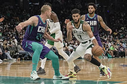 Oct 25, 2021; Charlotte, North Carolina, USA; Boston Celtics forward Jayson Tatum (0) drives to the basket against Charlotte Hornets center Mason Plumlee (24) during overtime at the Spectrum Center. Mandatory Credit: Jim Dedmon-USA TODAY Sports