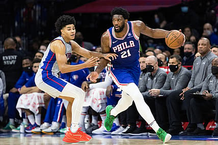 Oct 28, 2021; Philadelphia, Pennsylvania, USA; Philadelphia 76ers center Joel Embiid (21) dribbles past Detroit Pistons guard Killian Hayes (7) during the second quarter at Wells Fargo Center. Mandatory Credit: Bill Streicher-USA TODAY Sports