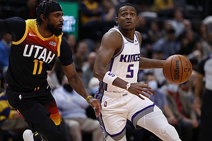 Nov 2, 2021; Salt Lake City, Utah, USA; Sacramento Kings guard De'Aaron Fox (5) drives against Utah Jazz guard Mike Conley (11) in the first quarter at Vivint Arena. Mandatory Credit: Jeffrey Swinger-USA TODAY Sports