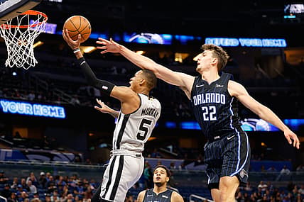 Nov 5, 2021; Orlando, Florida, USA; San Antonio Spurs guard Dejounte Murray (5) drives to the basket in the second quarter against Orlando Magic forward Franz Wagner (22) at Amway Center. Mandatory Credit: Nathan Ray Seebeck-USA TODAY Sports
