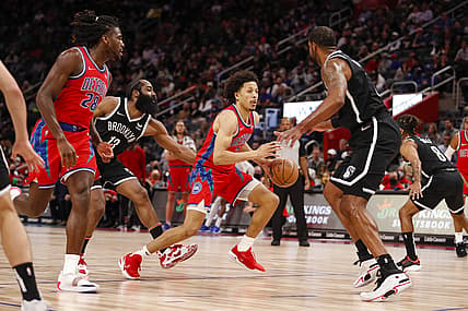 Nov 5, 2021; Detroit, Michigan, USA; Detroit Pistons guard Cade Cunningham (2) dribbles by Brooklyn Nets guard James Harden (13) during the second quarter at Little Caesars Arena. Mandatory Credit: Raj Mehta-USA TODAY Sports