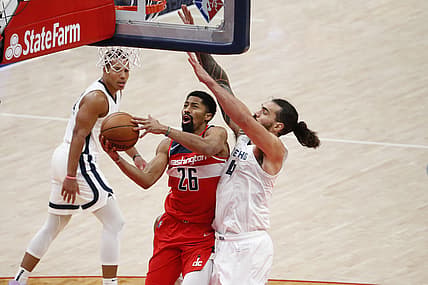 Nov 5, 2021; Washington, District of Columbia, USA; Washington Wizards guard Spencer Dinwiddie (26) shoots the ball as Memphis Grizzlies center Steven Adams (4) defends during the third quarter at Capital One Arena. Mandatory Credit: Amber Searls-USA TODAY Sports