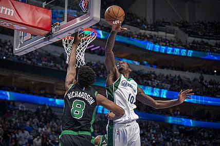 Nov 6, 2021; Dallas, Texas, USA; Dallas Mavericks forward Dorian Finney-Smith (10) blocks a shot by Boston Celtics guard Josh Richardson (8) during the first quarter at the American Airlines Center. Mandatory Credit: Jerome Miron-USA TODAY Sports