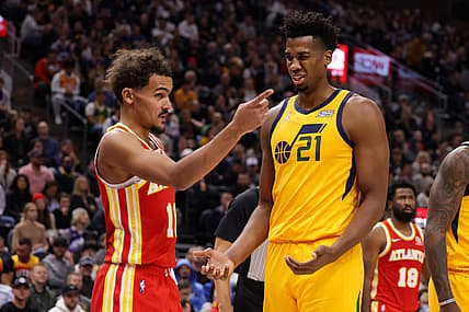 Nov 9, 2021; Salt Lake City, Utah, USA; Atlanta Hawks guard Trae Young (11) and Utah Jazz center Hassan Whiteside (21) react to call during the second quarter at Vivint Arena. Mandatory Credit: Chris Nicoll-USA TODAY Sports
