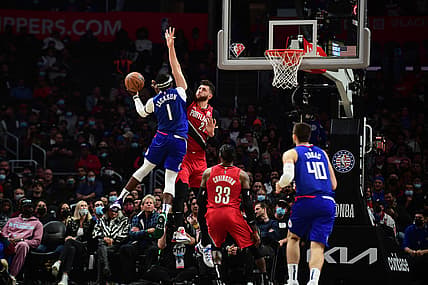 Nov 9, 2021; Los Angeles, California, USA; Los Angeles Clippers guard Reggie Jackson (1) moves to the basket against Portland Trail Blazers center Jusuf Nurkic (27) during the second half at Staples Center. Mandatory Credit: Gary A. Vasquez-USA TODAY Sports