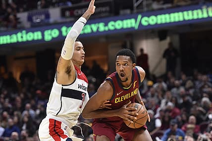 Nov 10, 2021; Cleveland, Ohio, USA; Washington Wizards forward Kyle Kuzma (33) defends Cleveland Cavaliers center Evan Mobley (4) in the fourth quarter at Rocket Mortgage FieldHouse. Mandatory Credit: David Richard-USA TODAY Sports