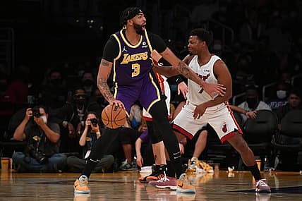 Nov 10, 2021; Los Angeles, California, USA; Los Angeles Lakers forward Anthony Davis (3) moves the ball against Miami Heat guard Kyle Lowry (7) during the first half at Staples Center. Mandatory Credit: Richard Mackson-USA TODAY Sports