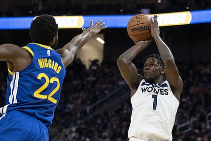 November 10, 2021; San Francisco, California, USA; Minnesota Timberwolves forward Anthony Edwards (1) shoots the basketball against Golden State Warriors forward Andrew Wiggins (22) during the fourth quarter at Chase Center. Mandatory Credit: Kyle Terada-USA TODAY Sports