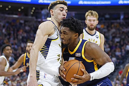 Nov 11, 2021; Salt Lake City, Utah, USA; Indiana Pacers guard Chris Duarte (3) and Utah Jazz guard Donovan Mitchell (45) battle in the fourth quarter at Vivint Arena. Mandatory Credit: Jeffrey Swinger-USA TODAY Sports