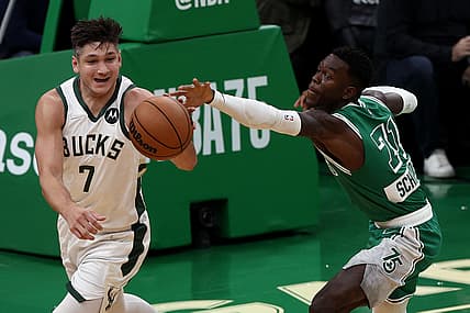 Nov 12, 2021; Boston, Massachusetts, USA; Boston Celtics guard Dennis Schroder (71) reaches in to try to steal the ball from Milwaukee Bucks guard Grayson Allen (7) during the first quarter at TD Garden. Mandatory Credit: Winslow Townson-USA TODAY Sports