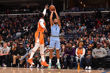 Nov 12, 2021; Memphis, Tennessee, USA; Memphis Grizzlies forward Kyle Anderson (1) shoots against Phoenix Suns forward Jae Crowder (99) during the first half  at FedExForum. Mandatory Credit: Justin Ford-USA TODAY Sports
