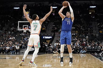 Nov 12, 2021; San Antonio, Texas, USA; Dallas Mavericks guard Luka Doncic (77) shoots over San Antonio Spurs guard Bryn Forbes (7) during the second half at AT&T Center. Mandatory Credit: Scott Wachter-USA TODAY Sports