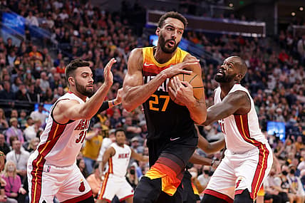 Nov 13, 2021; Salt Lake City, Utah, USA;  Utah Jazz center Rudy Gobert (27) grabs the rebound away from Miami Heat guard Max Strus (31) and center Dewayne Dedmon (21) during the second quarter at Vivint Arena. Mandatory Credit: Chris Nicoll-USA TODAY Sports