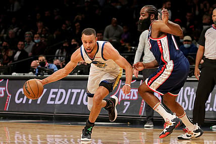 Nov 16, 2021; Brooklyn, New York, USA; Golden State Warriors guard Stephen Curry (30) drives around Brooklyn Nets guard James Harden (13) during the first quarter at Barclays Center. Mandatory Credit: Brad Penner-USA TODAY Sports