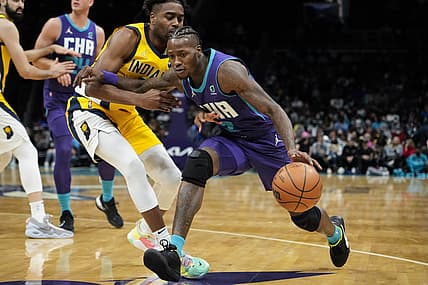 Nov 19, 2021; Charlotte, North Carolina, USA; Charlotte Hornets guard Terry Rozier (3) drives to the basket against Indiana Pacers guard Kelan Martin (21) during the second quarter at the Spectrum Center. Mandatory Credit: Jim Dedmon-USA TODAY Sports