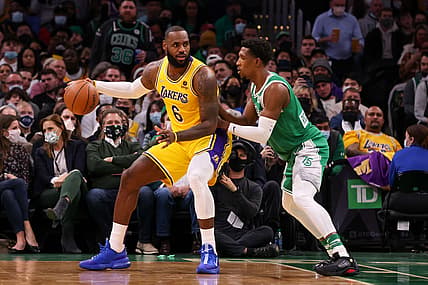 Nov 19, 2021; Boston, Massachusetts, USA; Los Angeles Lakers forward LeBron James (6) dribbles down the court defended by Boston Celtics guard Josh Richardson (8) during the first half at TD Garden. Mandatory Credit: Paul Rutherford-USA TODAY Sports
