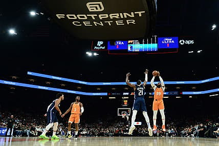 Nov 19, 2021; Phoenix, Arizona, USA; Phoenix Suns forward Jae Crowder (99) shoots over Dallas Mavericks guard Frank Ntilikina (21) during the first half at Footprint Center. Mandatory Credit: Joe Camporeale-USA TODAY Sports