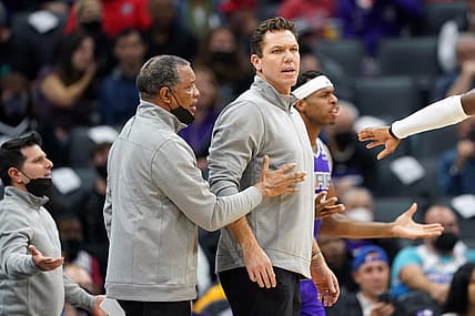 Nov 20, 2021; Sacramento, California, USA; Sacramento Kings head coach Luke Walton is restrained by assistant coach Alvin Gentry during the second quarter against the Utah Jazz at Golden 1 Center. Mandatory Credit: Darren Yamashita-USA TODAY Sports