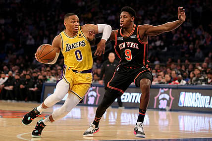 Nov 23, 2021; New York, New York, USA; Los Angeles Lakers guard Russell Westbrook (0) drives to the basket against New York Knicks guard RJ Barrett (9) during the first quarter at Madison Square Garden. Mandatory Credit: Brad Penner-USA TODAY Sports