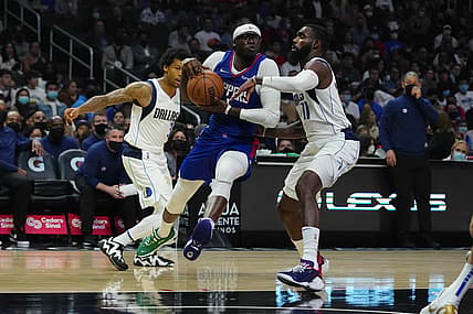 Nov 23, 2021; Los Angeles, California, USA; LA Clippers guard Reggie Jackson (1) is defended by Dallas Mavericks forward Tim Hardaway Jr. (11) in the first half at Staples Center. Mandatory Credit: Kirby Lee-USA TODAY Sports