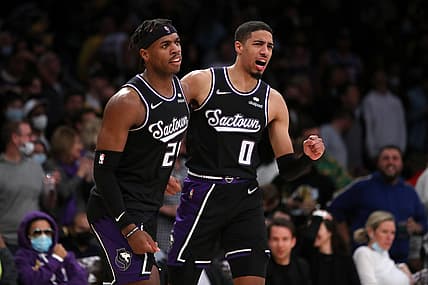 Nov 26, 2021; Los Angeles, California, USA; Sacramento Kings guard Tyrese Haliburton (0) celebrates with guard Buddy Hield (24) after Hield scored a basket in the first overtime against the Los Angeles Lakers at Staples Center. The Kings won 141-137 in triple-overtime. Mandatory Credit: Kiyoshi Mio-USA TODAY Sports