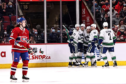 Nov 29, 2021; Montreal, Quebec, CAN; Vancouver Canucks right wing Conor Garland (8) celebrates his goal against Montreal Canadiens with teammates during the second period at Bell Centre. Mandatory Credit: Jean-Yves Ahern-USA TODAY Sports